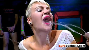 A beautiful European woman gets drilled hard by a group of men in this bukkake video